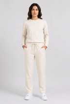 Woman wearing cream tracksuit front view