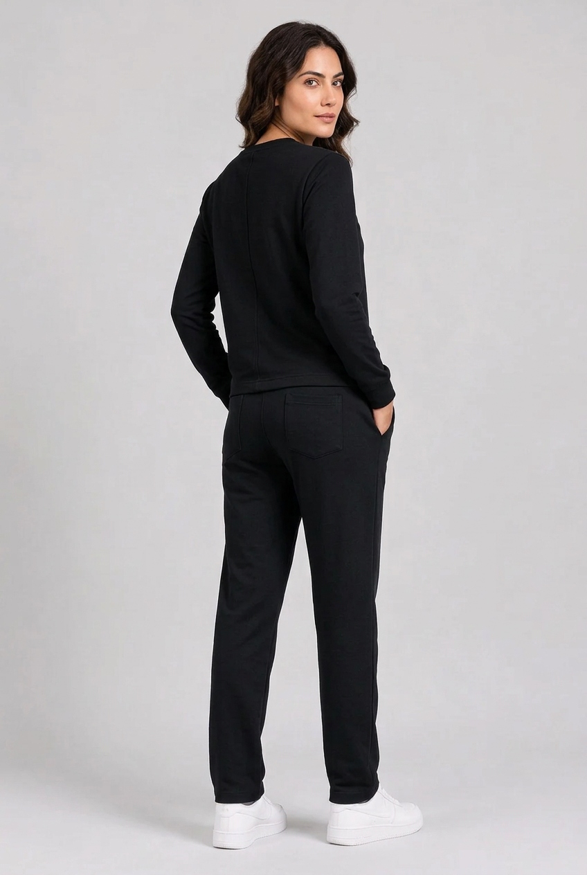 Woman wearing plain black tracksuit back view