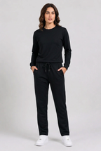 Woman wearing plain black tracksuit front view